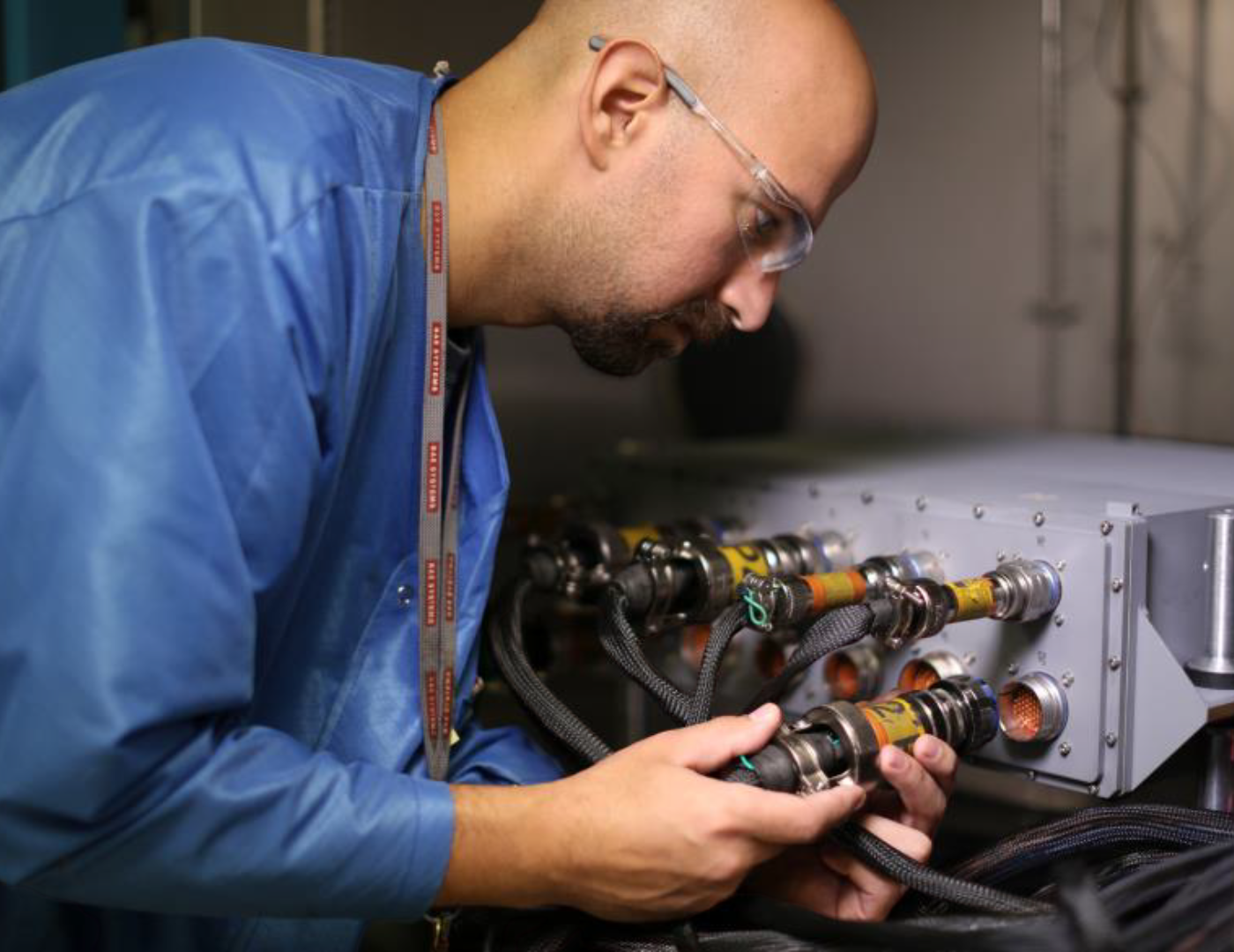 Fort Wayne operations professional works on a piece of technology.