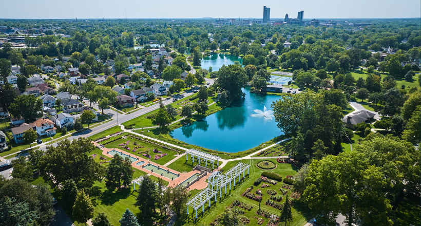 Image of Aerial Lakeside Park gardens and fountains with distant downtown Fort Wayne