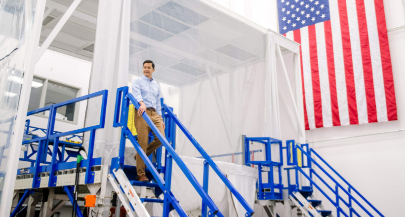 Dave, a quality assurance leader for Space & Mission Systems, walks through a manufacturing site at the Boulder facility.