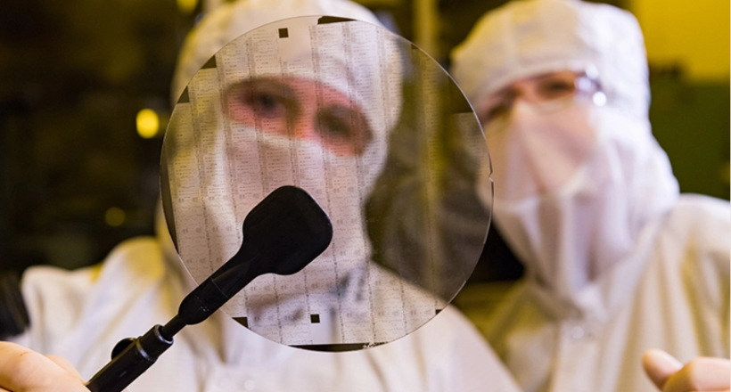 BAE Systems scientists working in a clean room.