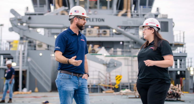 David and Sara discuss a project at the Jacksonville ship repair site.