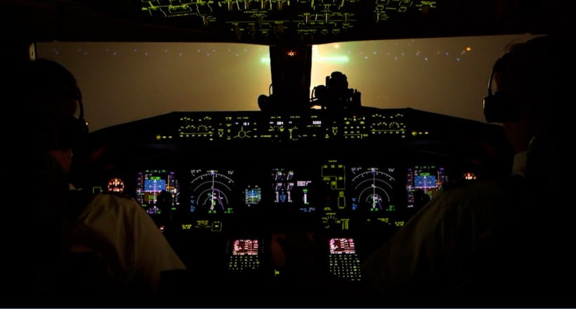View from the cockpit  as two pilots fly an airplane