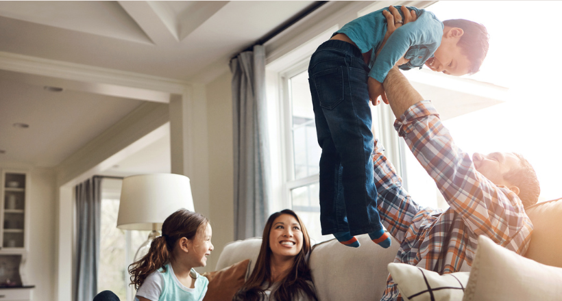 Family hangs on the family room couch.