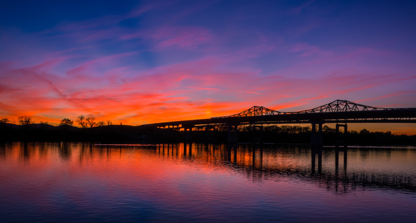 Sunset over the Whitesburg bridge at Ditto Landing in Huntsville, Alabama.