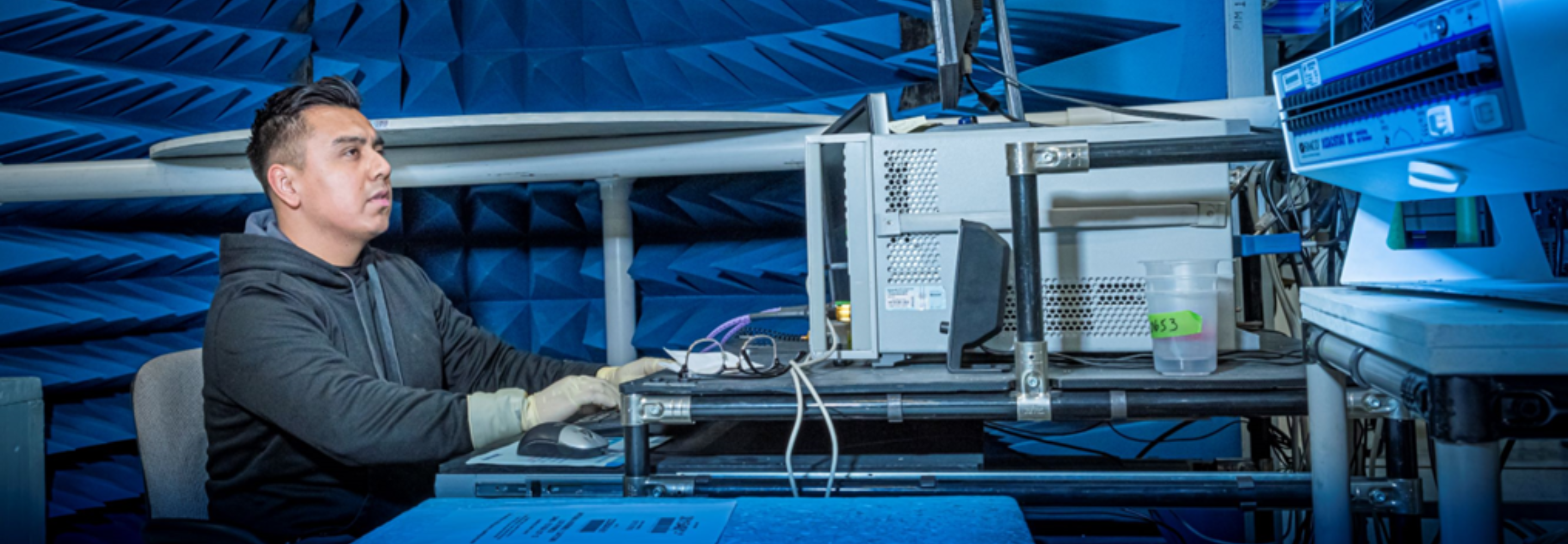 A systems engineer on our space & mission systems team works on a computer.