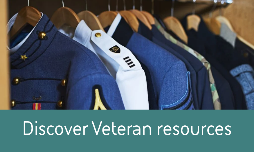 Military dress uniforms hanging on a rack, representing veteran resources and support at BAE Systems.