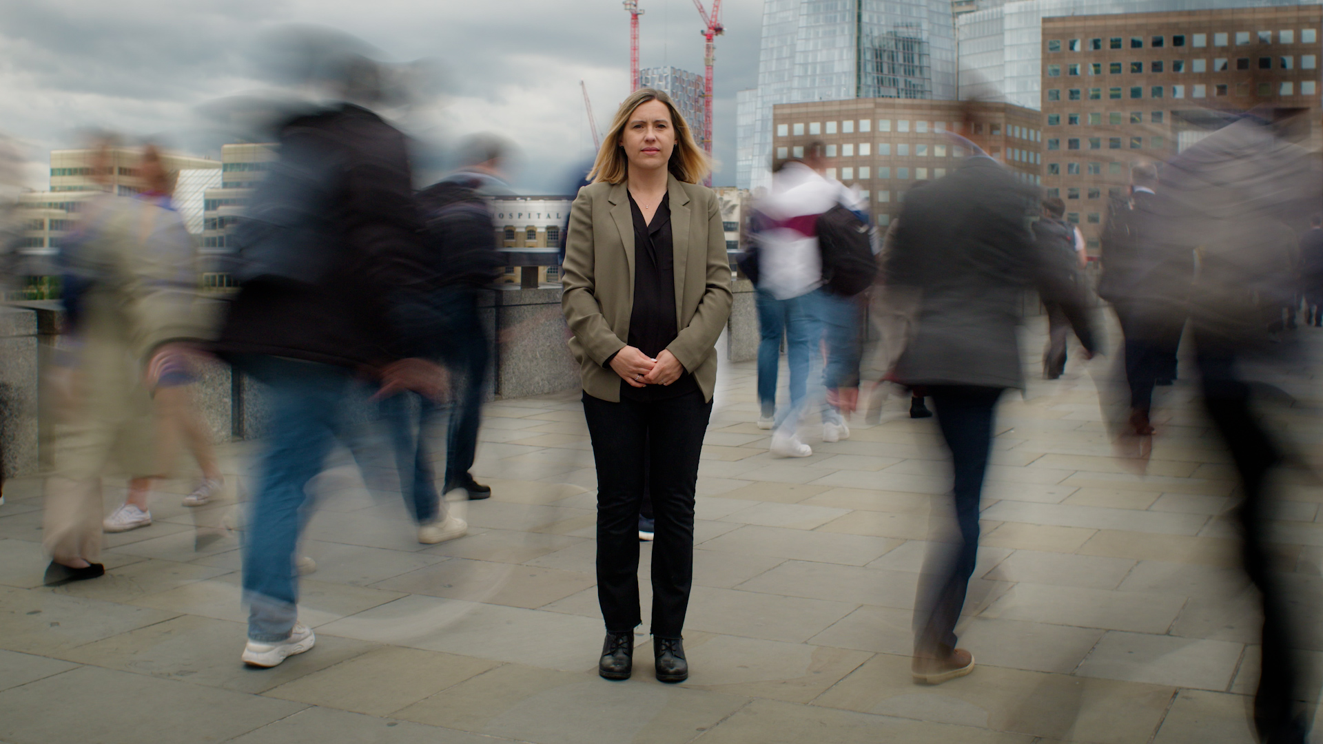 Woman standing on a busy UK bridge