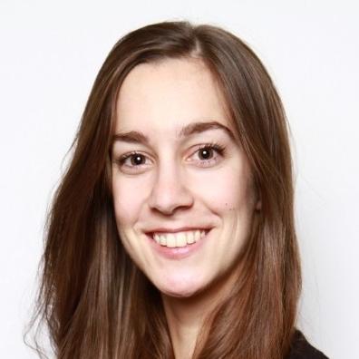 A photo of a woman named Briar smiling at the camera