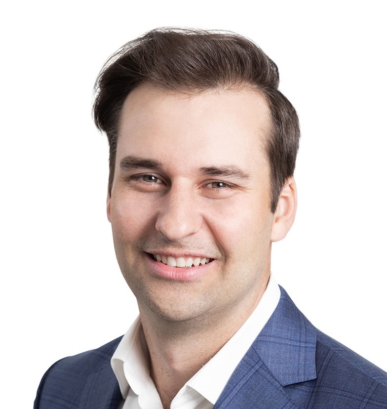 A photo of a man named Peter smiling at the camera