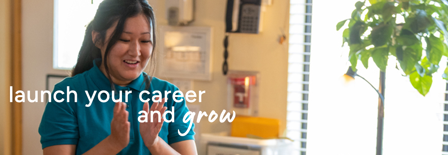 Person in teal shirt clapping in a workplace setting, with motivational text overlay.