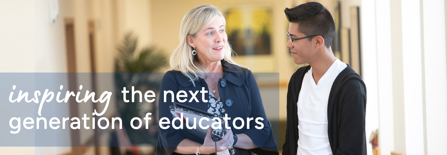 Woman and young man walking through a hallway, engaged in conversation.