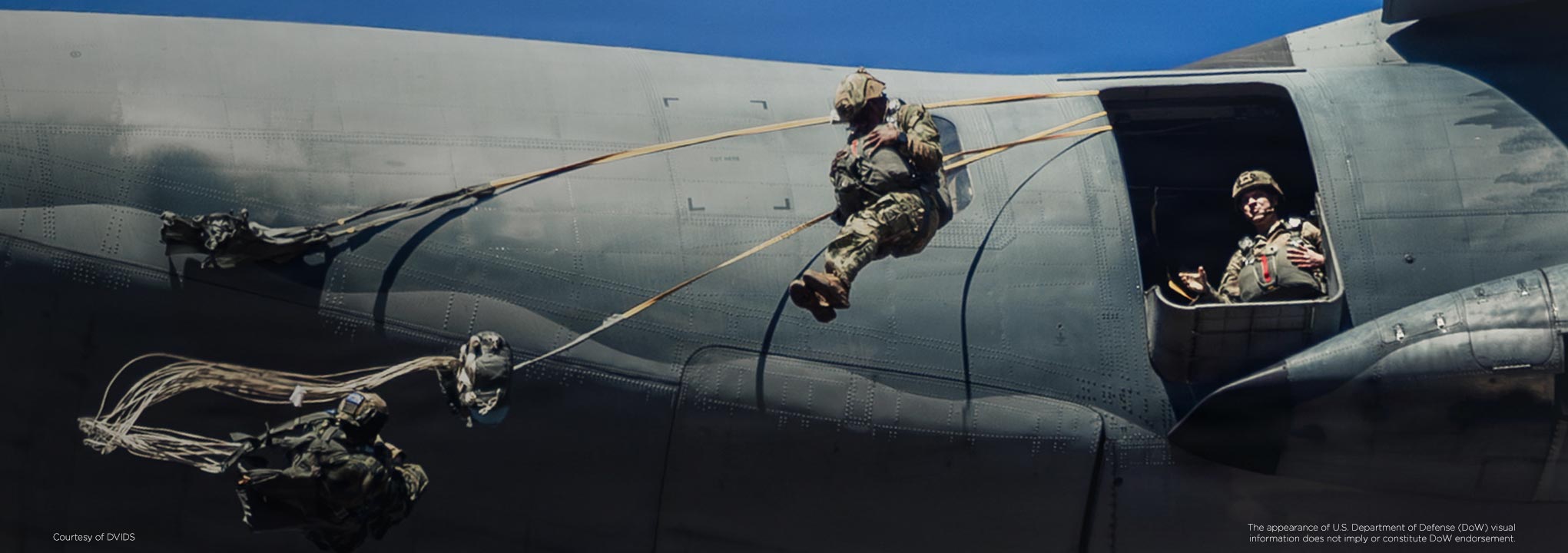 soldiers-jumping-out-of-a-plane-2041x720