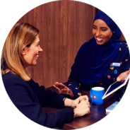 Two women, a branch employee and a customer, converse