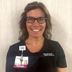 Karen L., physical therapist assistant, smiling in a Bon Secours Mercy Health rehabilitation setting