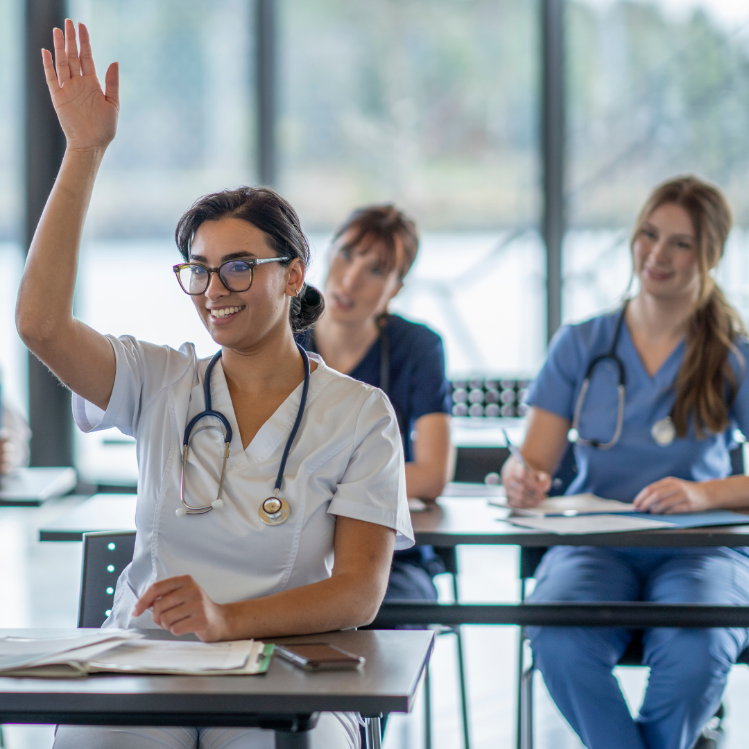 Nursing student raising her hand