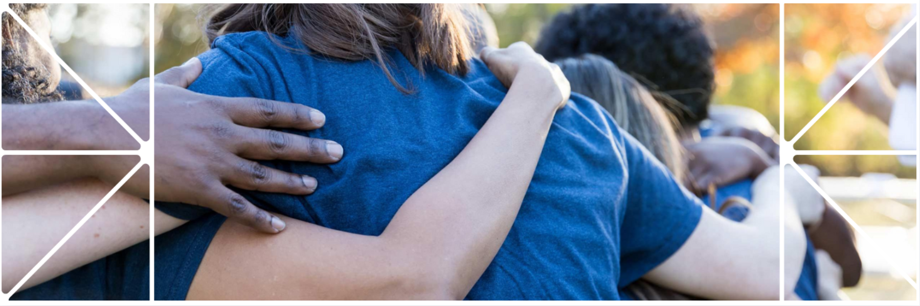Close-up of a group hug with arms wrapped around one another, wearing matching blue shirts. The image is framed with a white geometric brand pattern, evoking connection and community.