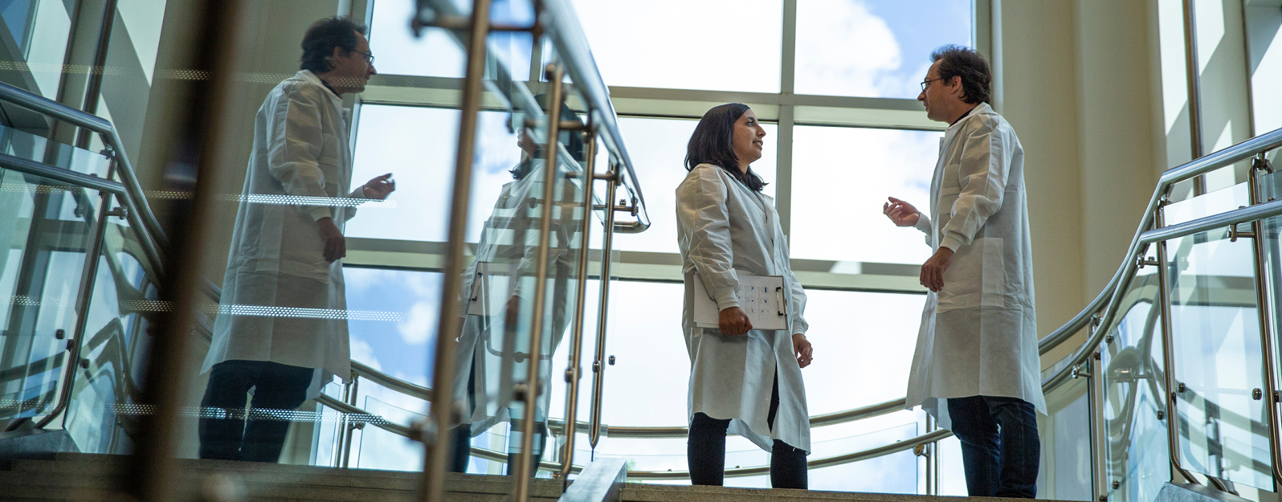 physicians speaking on stairs