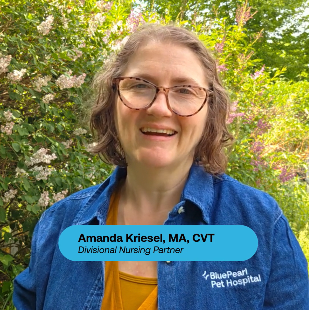 Amanda Kriesel, a woman with shoulder-length hair in glasses and a blue denim shirt.