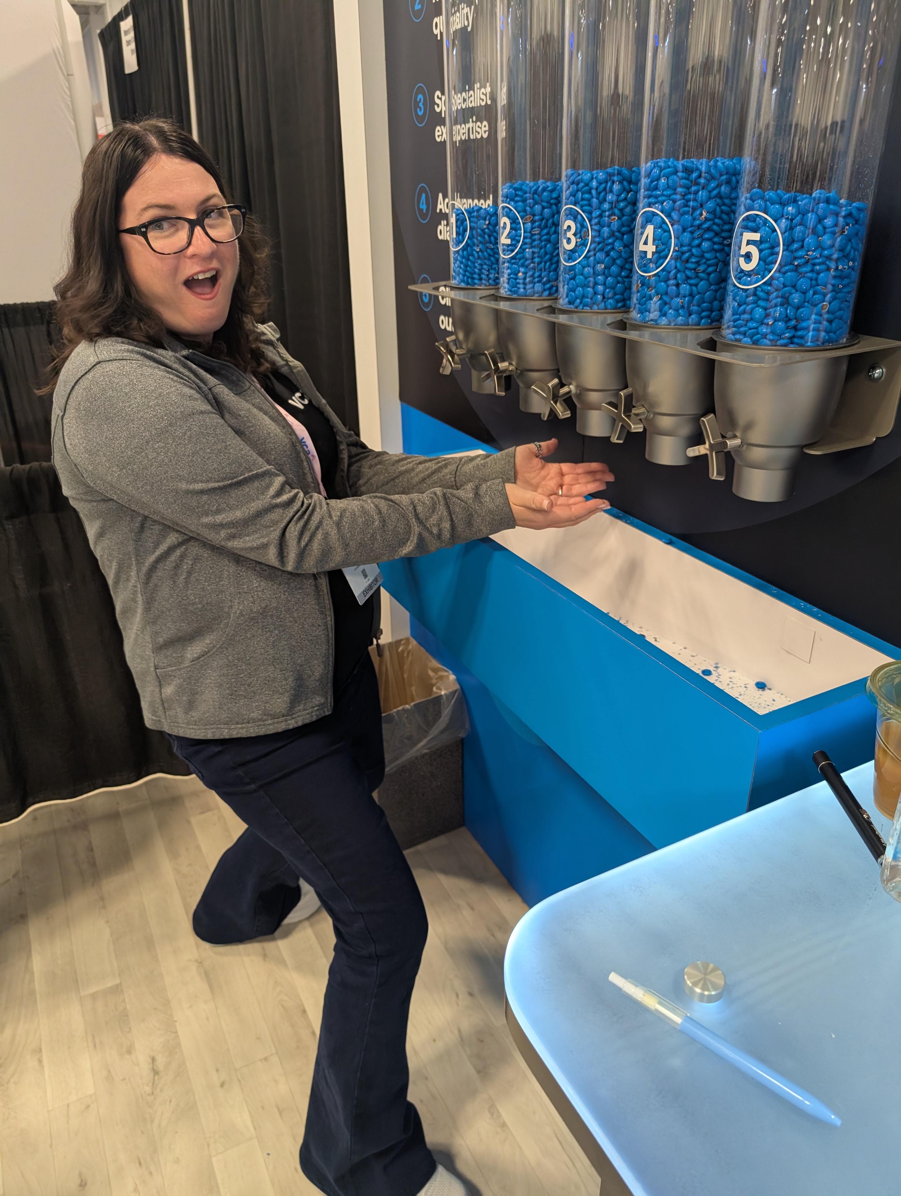 A friend at ACVIM enjoys BluePearl's candy wall.