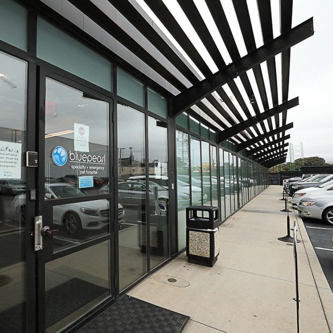The front of BluePearl Westide, with glass front and black overhang.