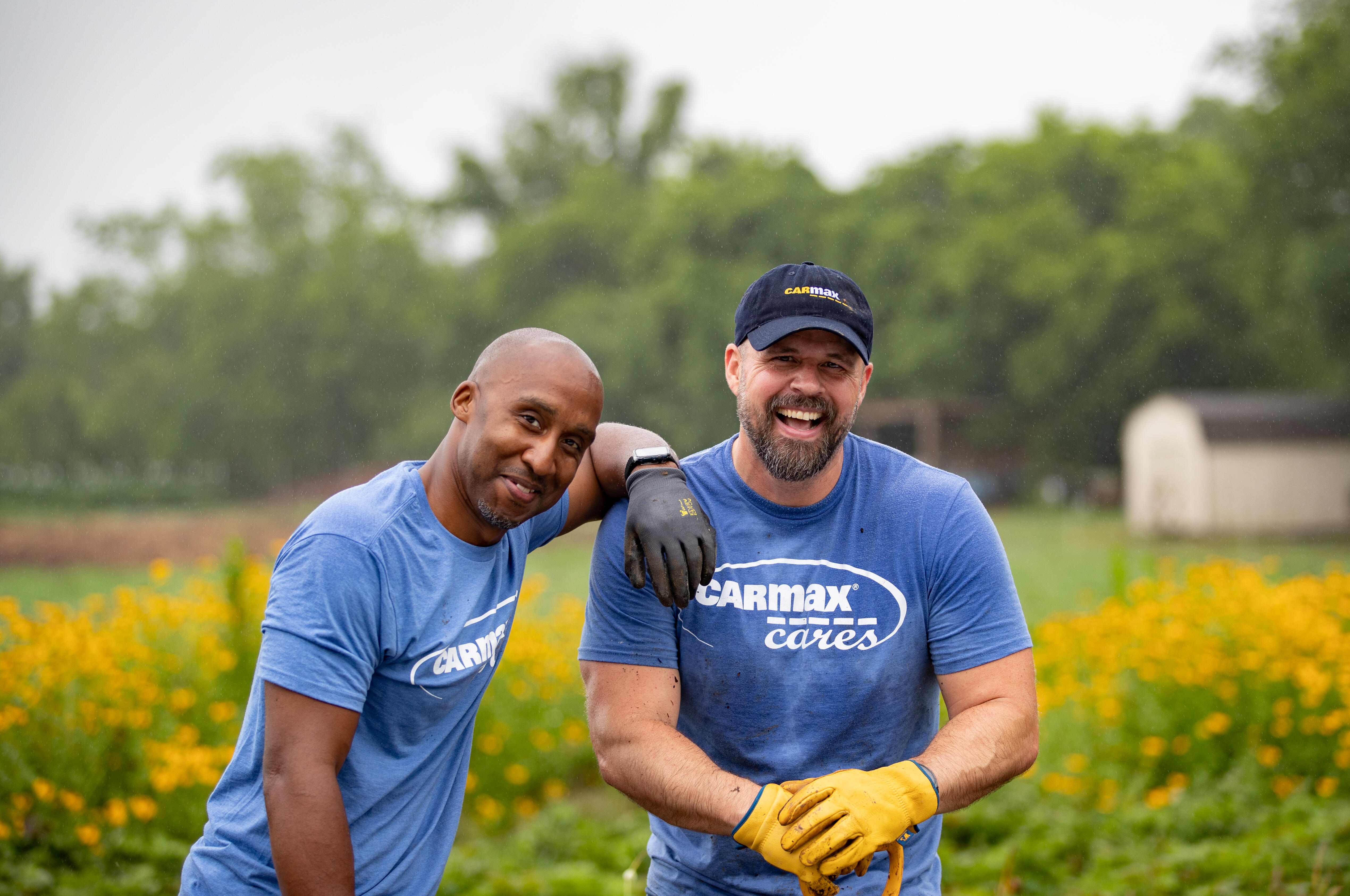 Two male employees supporting local communities