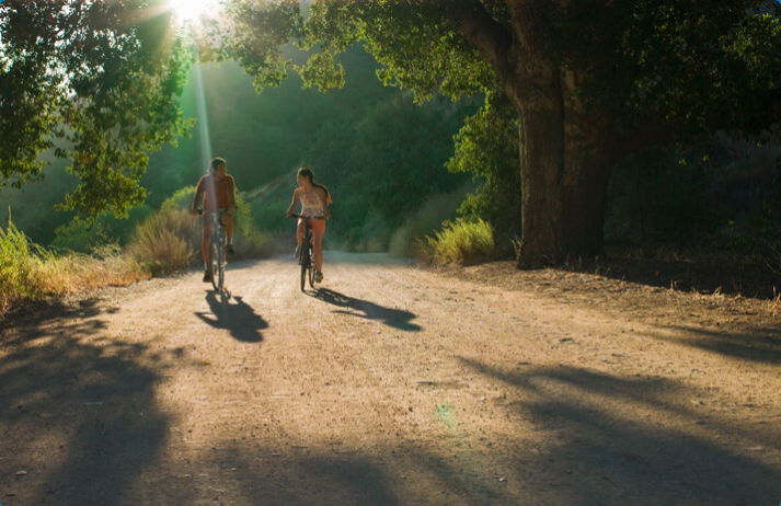 Two people outdoor biking