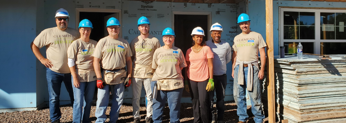 Team members volunteering at a service project.