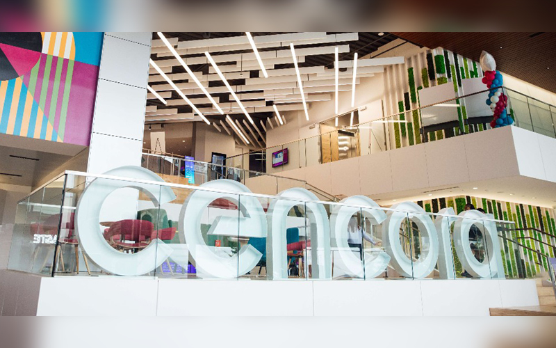 Our Cencora HQ. A large Cencora sign stands in front of an open office area.