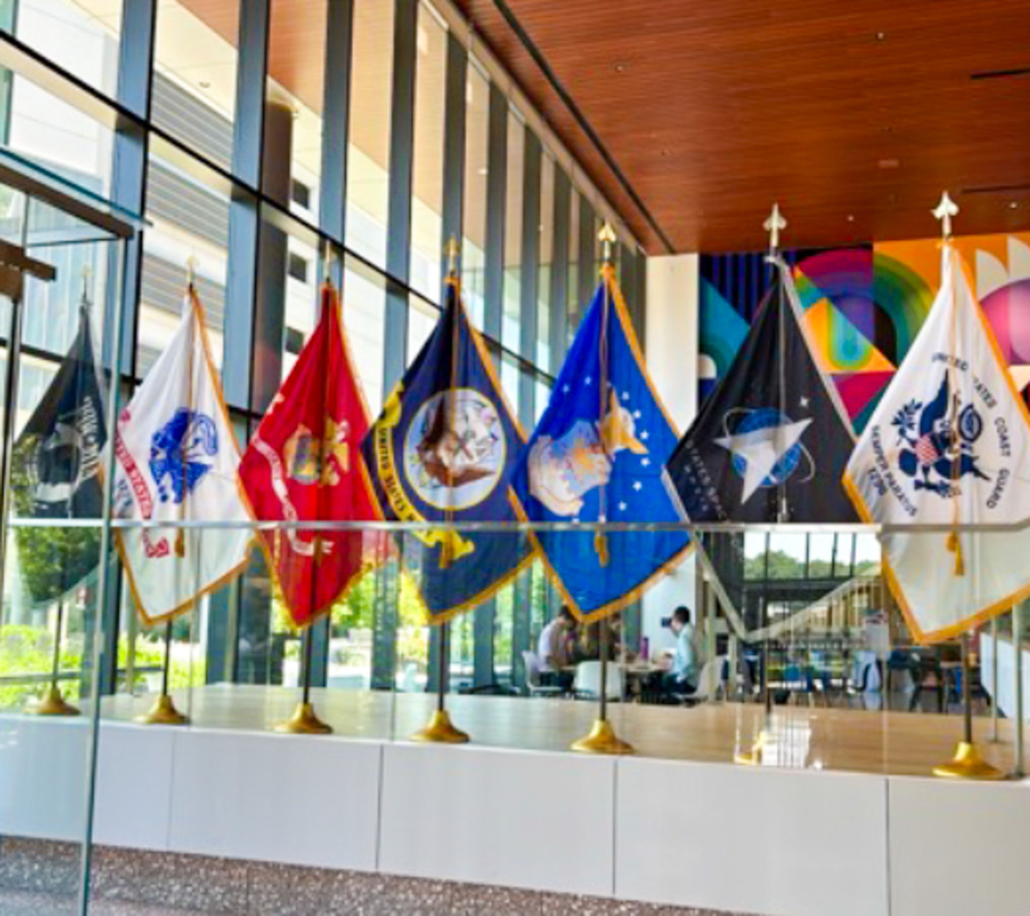 Several flags representing branches of the armed forces are displayed in Cencora's headquarters in honor of Memorial Day. 