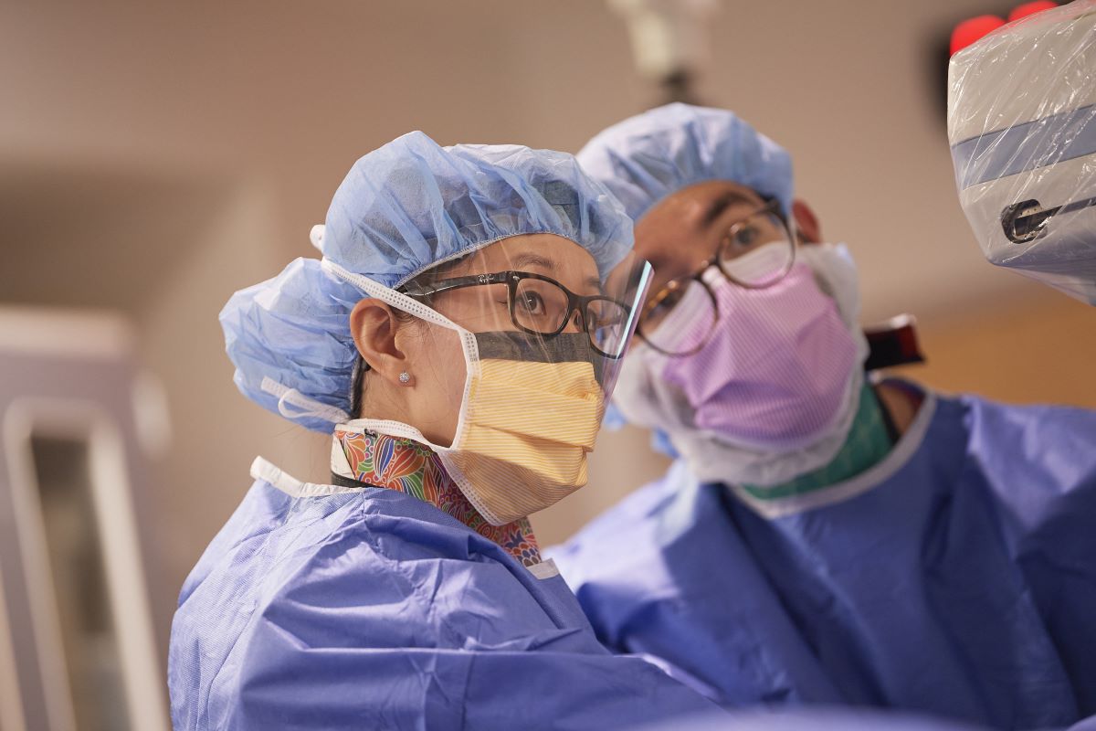 CHOP surgical team examines a screen.