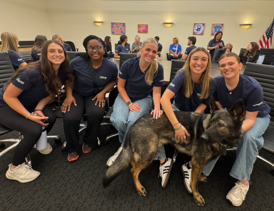 SCDP participants posing with a dog