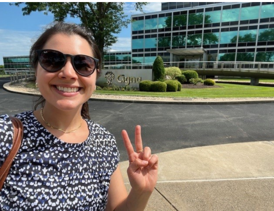 HSLDP associate posing in front of The Cigna Group building
