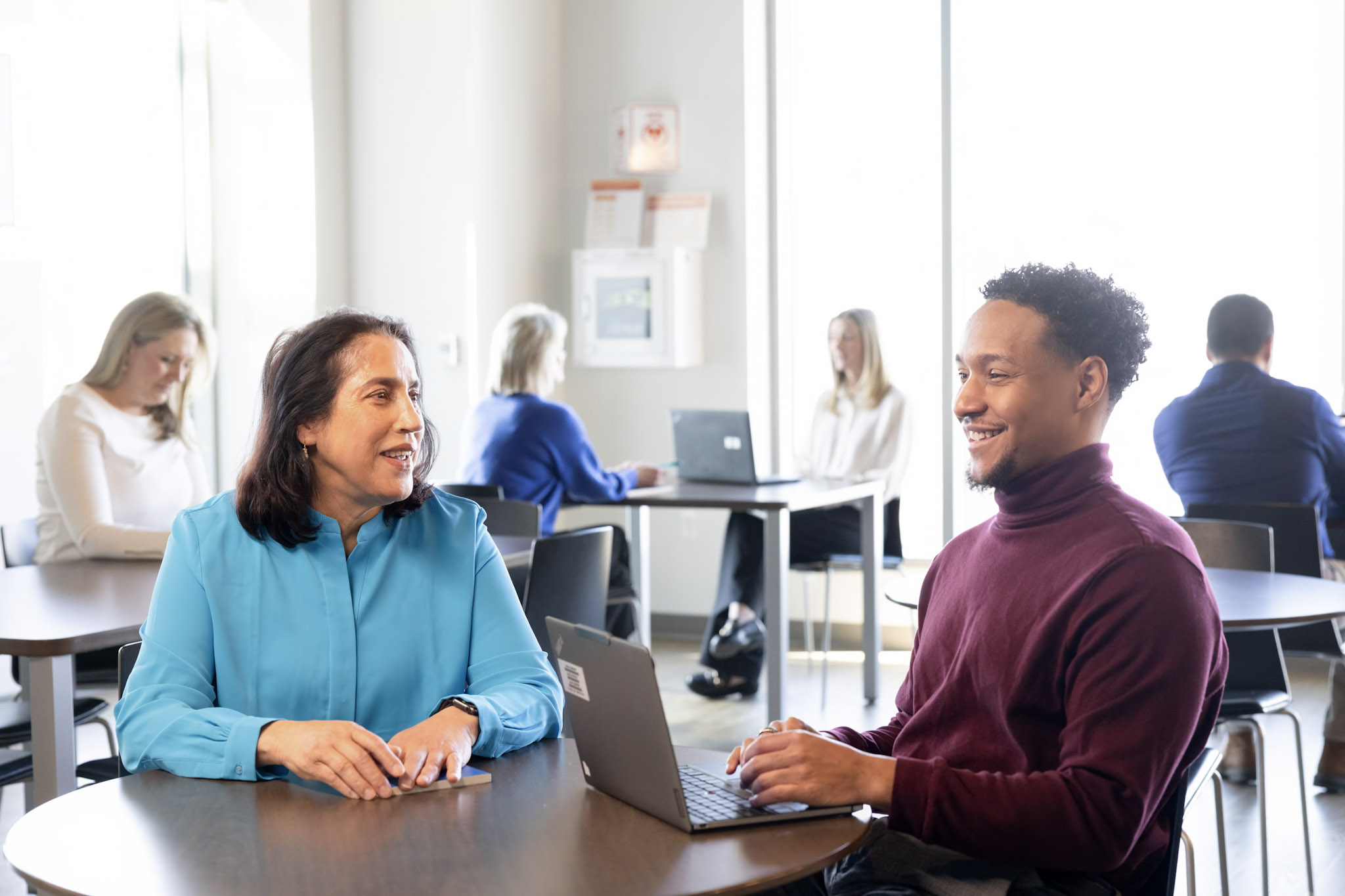 Employees sitting together meeting briefly