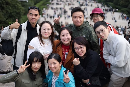 Group of employees from China posing for a group photo