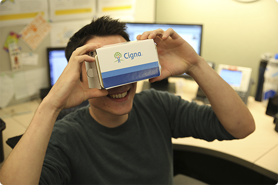 Cigna employee showing off his branded virtual technology.