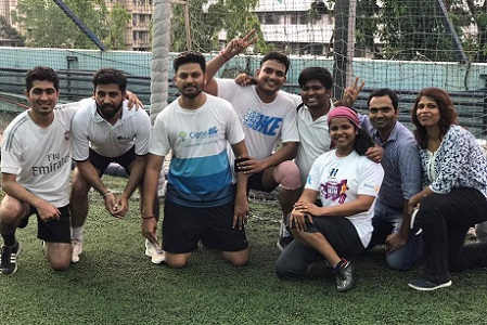 Cigna India employees pose for a team photo.