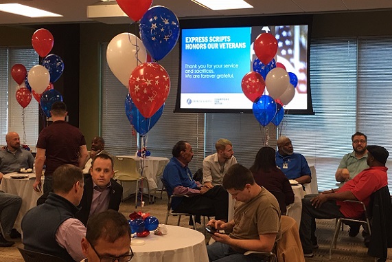 Flag raising ceremony taking place at our St. Louis office in celebration of Veterans Day.