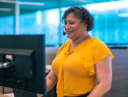 Call Center employee working at her computer