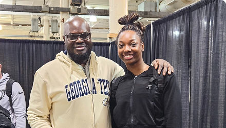 A father with his arm around his daughter