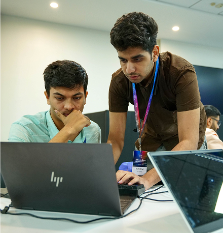 Two participants working together on a laptop