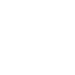 A human figure stands at a board with writing on it while a group of people sits in front  of them.