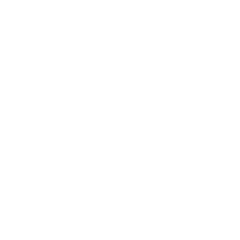 A desk with a computer screen and a plant on top.