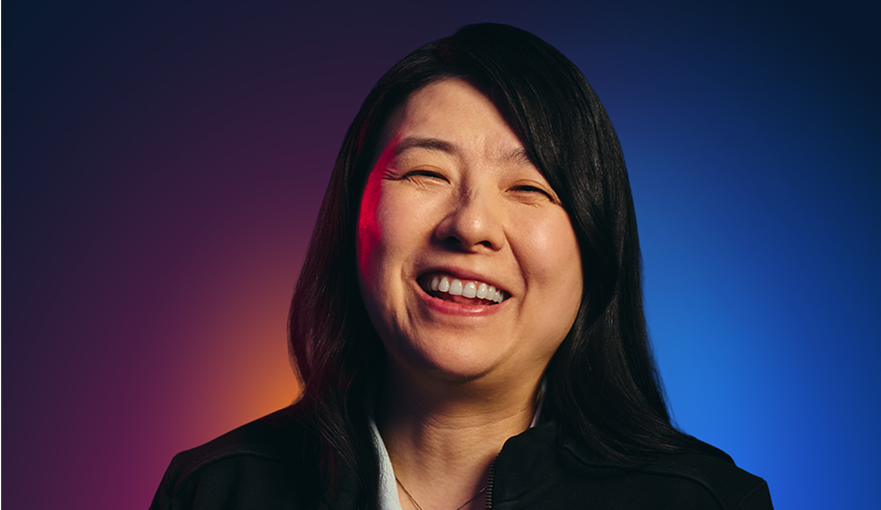 Michelle Mao smiles while looking at the camera.