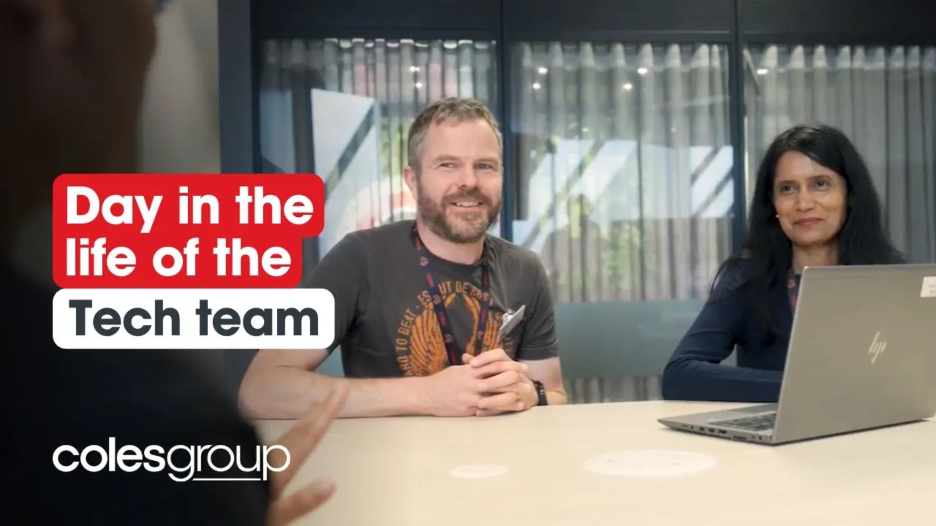 Male and Female team members in Tech having a meeting at Coles Group