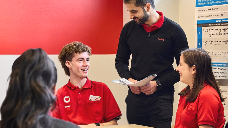 A group of young Supermarket team members enjoying a break in Coles break room