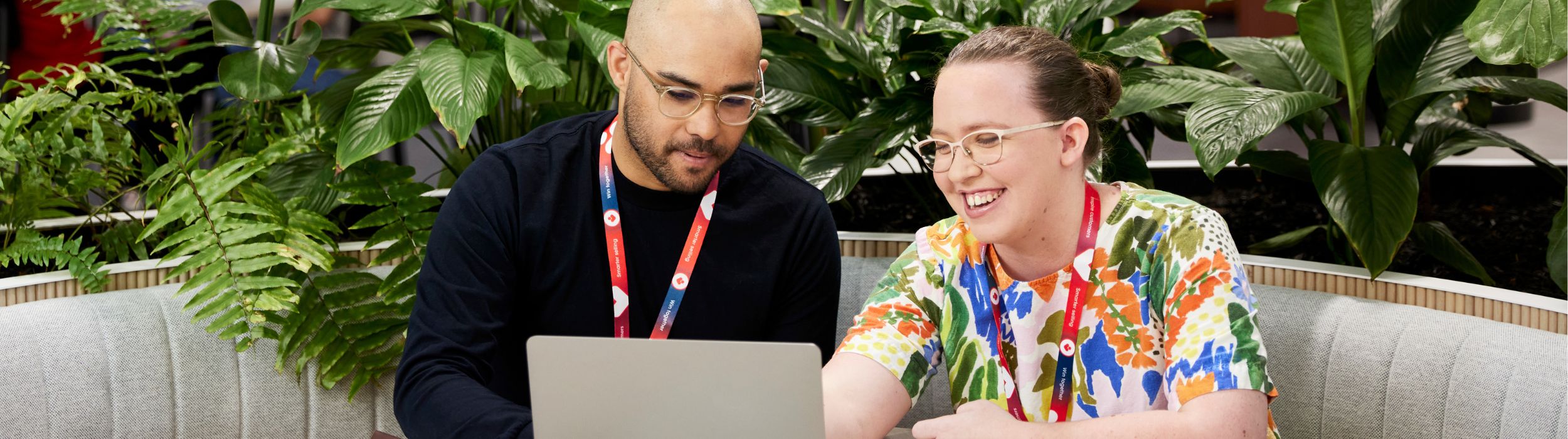 Male and female team members working at the SSC