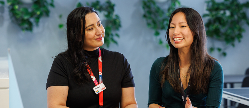 Two female grads having a conversation at the SSC
