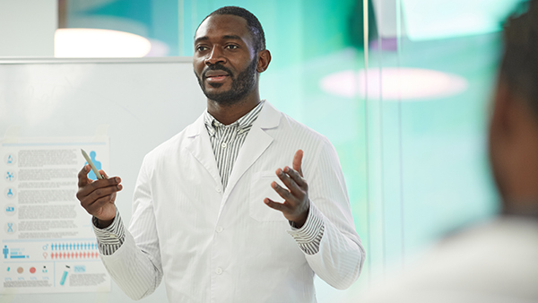 Scientist teaching students in the lab.