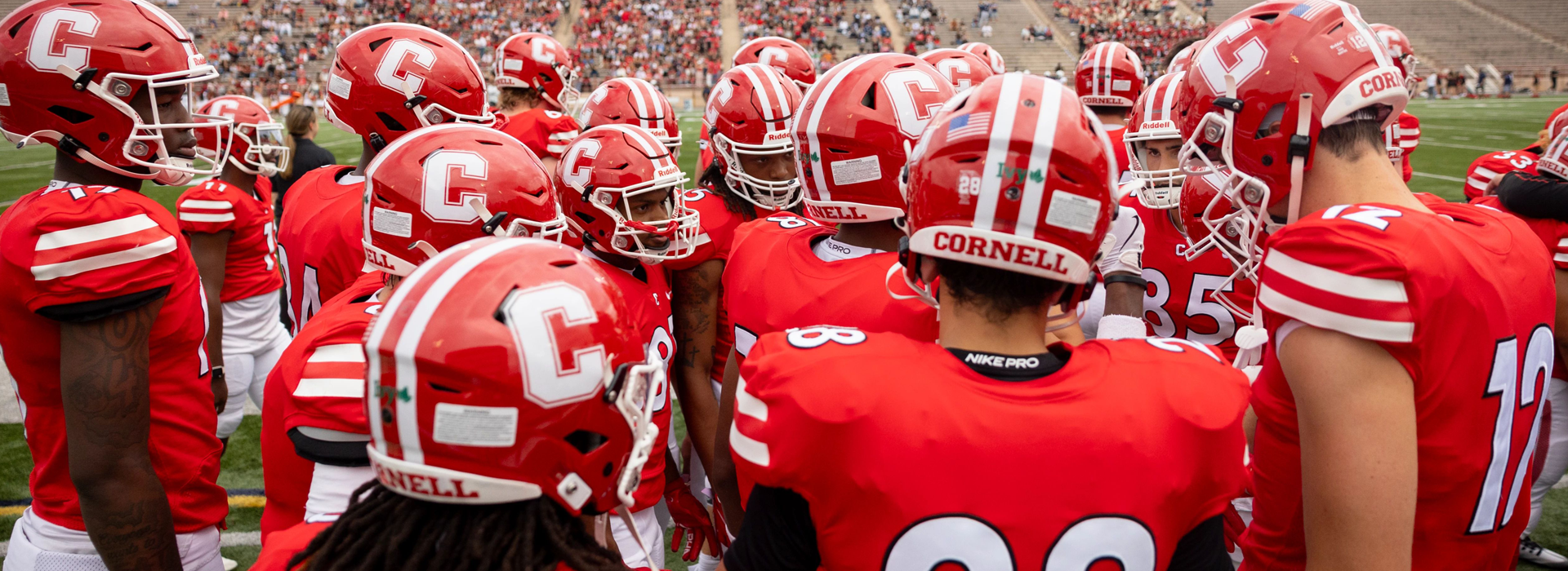 cornell football team huddle