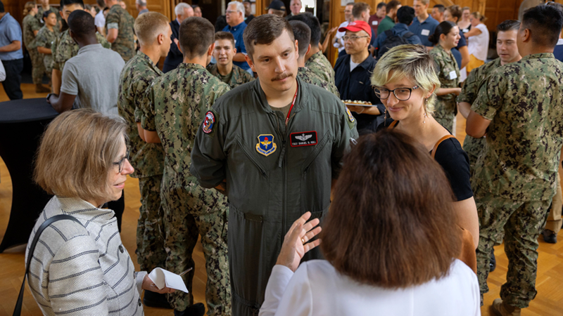 military personnel mingling at social gathering